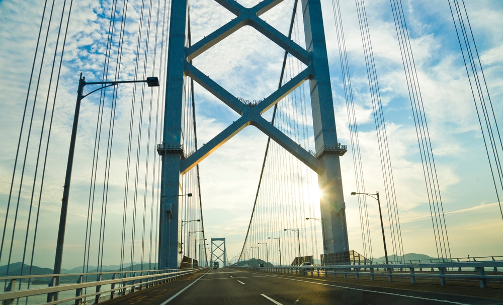 Drive on the Akashi Kaikyo Bridge, that's the world's longest suspension bridge, and connects Kobe town to Awaji Island.