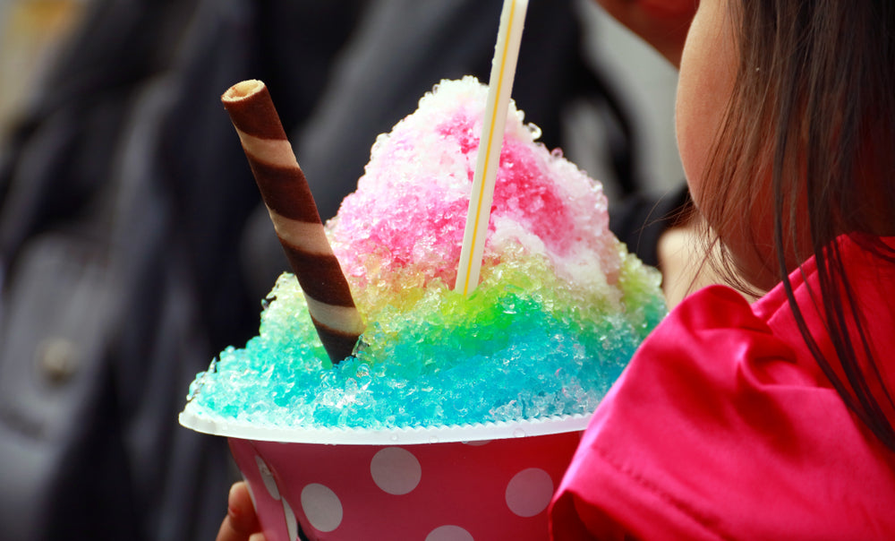 Child eating drink kakigori in summer